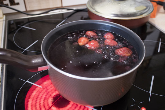 compote with berries in the ladle
