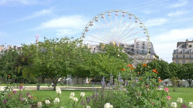 Professional video of giant wheel in the tuileries garden in 4K slow motion 60fps