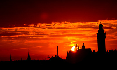 Sunset behind the city hall, highlighting the skyline of Leipzig, Germany
