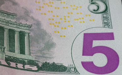 fragment of 5 dollar bill