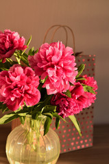 Sunny fresh bunch of pink peonies peony roses flowers background. Garden spring flowers, Card Concept, copy space for text. mom's day, birthday, celebration wallpaper, copy space.