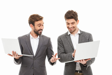 Portrait of a two excited business men working