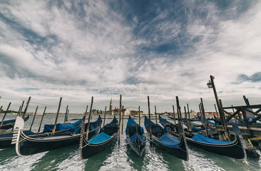wide angle view of Traditional Gondolas in St Marco or Saint Mark's square in Venice