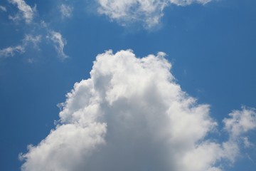 Fluffy Billowy Cumulus Clouds Backlit by the Sun in the Blue Summer Sky in Florida