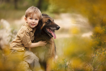 a little child with a big dog are best friends