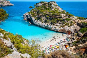 Calo des Moro, Mallorca on a sunny day with people on the beach