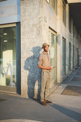 Obraz na płótnie Canvas young handsome millennial black man outdoor posing looking away - customer, attitude concept