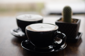 Coffee cup and coffee beans on table