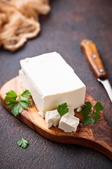 Feta cheese on rusty background