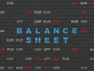 Money concept: Painted blue text Balance Sheet on Black Brick wall background with Currency
