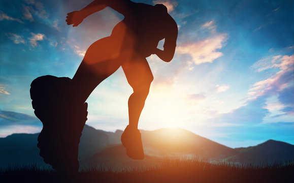 Man running towards the sunset in the mountains