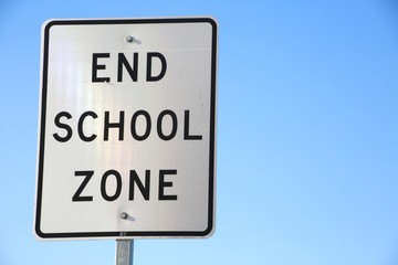 End School Zone Sign against Clear Blue Sky