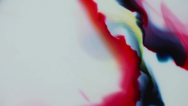 Different colors of paint move toward the others
