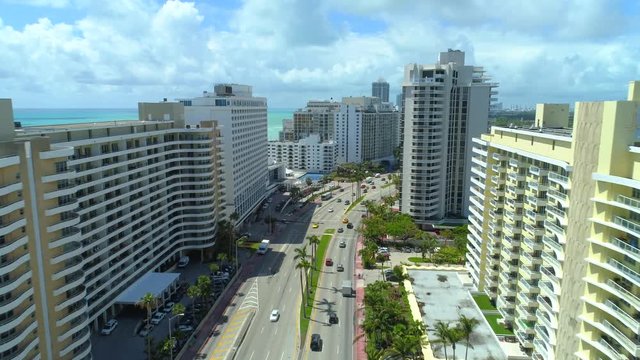 Aerial drone video shot Miami Beach upscale condominiums on Collins Avenue
