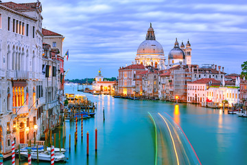 Grand canal and The Basilica of St Mary of Health or Basilica di Santa Maria della Salute at night in Venice, Italy