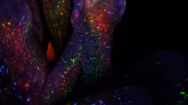 Gently Woman in Neon UV Light. Model Girl with Fluorescent Creative Psychedelic MakeUp, Art Design of Female Disco Dancer Model in UV