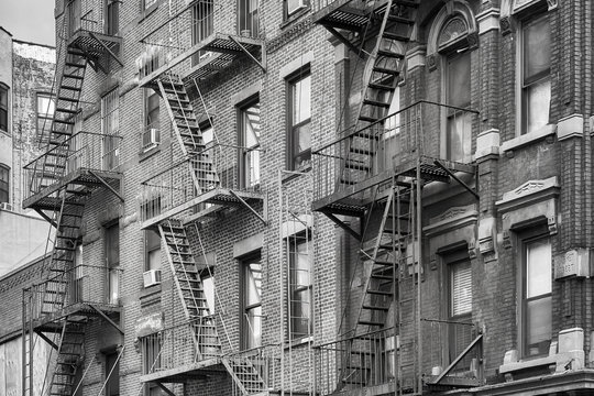 Black and white picture of fire escapes, one of the New York City symbols, USA. 