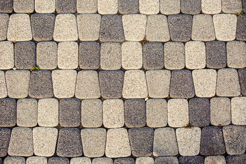 Fragment of stone pavement cobble-stones texture as a background