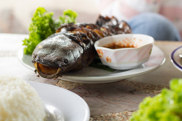 Thailand street food market, fish grilled. Business street food, fish.