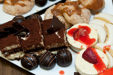 Wedding sweet table, cheesecake, tiramisu, apple crostada, chocolate zuccotto bites, vera lemon cookies
