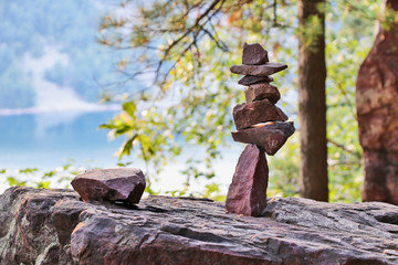 Beautiful Wisconsin nature background.Scenic view with stones pyramid on a lake background in blur at south shore ice age hiking trail. Devil's Lake State Park, Baraboo area, Wisconsin, Midwest USA.