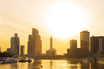 Obraz premium Cityscape and Landscape of downtown Moscow with Modern skyscrapers, office building and Moskva river over Sunrise sky, Moscow City, Russia
