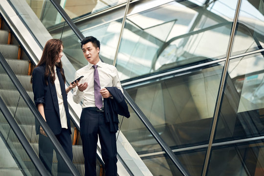 Business people use mobile phones