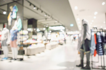 Abstract blur clothing boutique display interior of shopping mall background