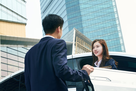Young woman driving cars
