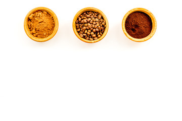 Ground seasoning for cooking desserts. Cinnamon, cocoa, coffee powder on white background top view copy space