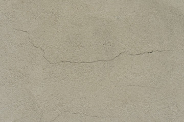 Wall fragment with scratches and cracks