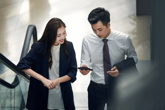 Business people use mobile phones