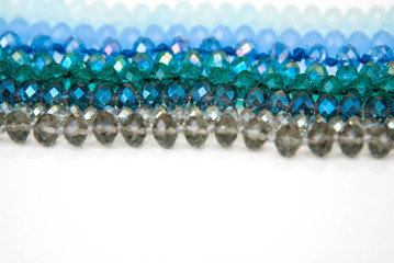 Blue Green Colorful Shinny Crystal Beads Glass Isoalted on White Background Copy space Hobby Handmade Fashion Beauty