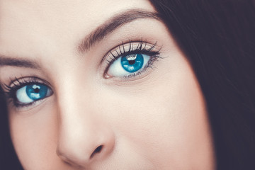 Obraz premium Beautiful insightful look blue woman's eyes.