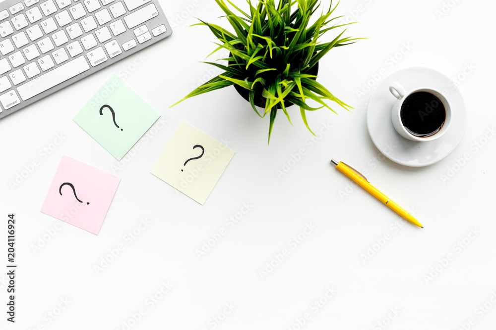 Poster question mark on sticky notes on office desk on white background top view copy space. faq concept. w