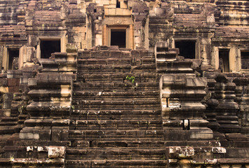 Ancient stairs of the Angkor Thom Baphuon Temple in the Angkor Area, near Siem Reap, Cambodia, Asia. Buddhist monastery from the 12th century. Asian architectural background.