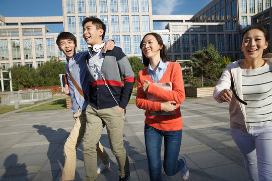 Cheerful college students in college campus