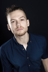 Fototapeta premium Young ginger man studio portrait