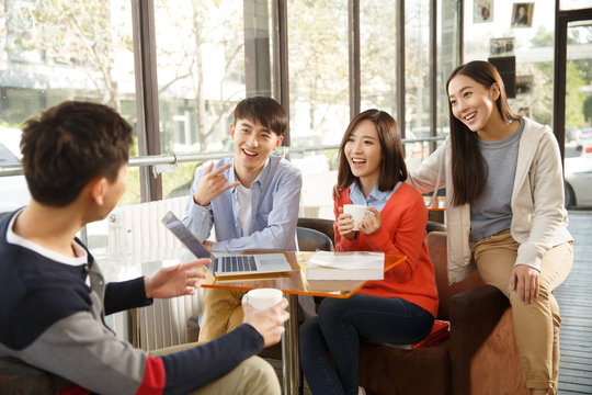 Young men and women in the coffee shop