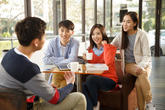 Young men and women in the coffee shop