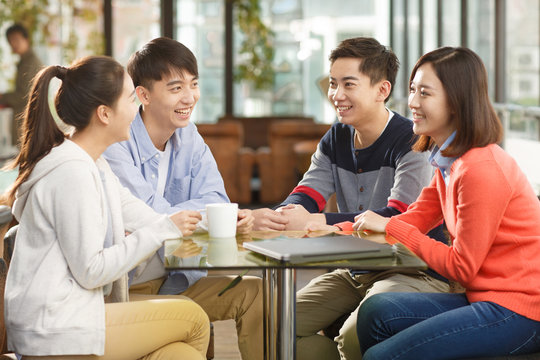 Young men and women in the coffee shop