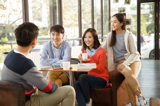 Young men and women in the coffee shop