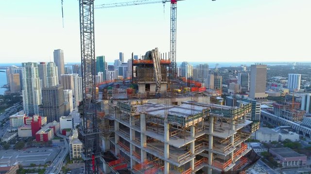 Industrial skyscraper construction site inspection with drone aerial footage 4k 60p