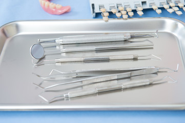 Close up dentist tools on metal tray in dental clinic, preparation before operating.