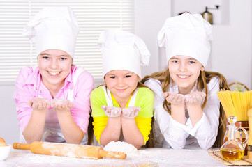 three cute girls  cooking