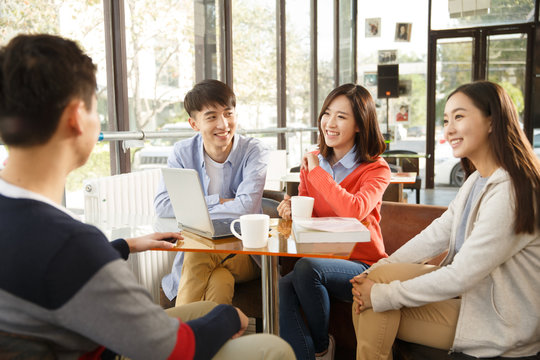 Young men and women in the coffee shop