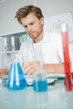 man in the laboratory with flasks