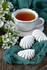 Spring flowers background with tea cup