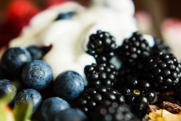 Macro view of blackberries, blueberries and yogurt