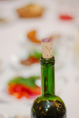 Bottle neck of red wine closed by cork
